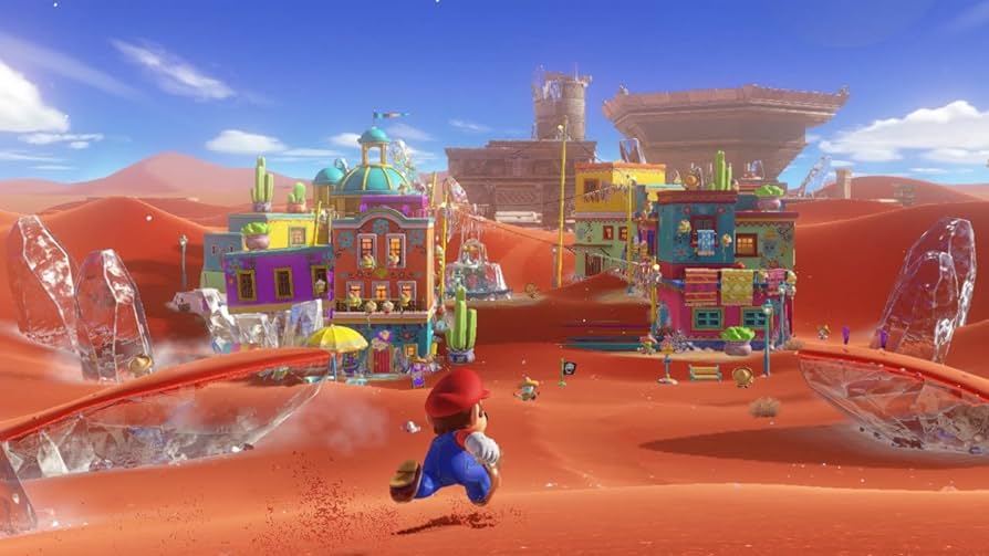 Captura do Super Mario Odyssey, o protagonista percorre un deserto con edificios de estética mexicana.