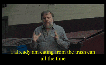Slavoj Žižek dizendo "I already am eating from the trash can all the time".